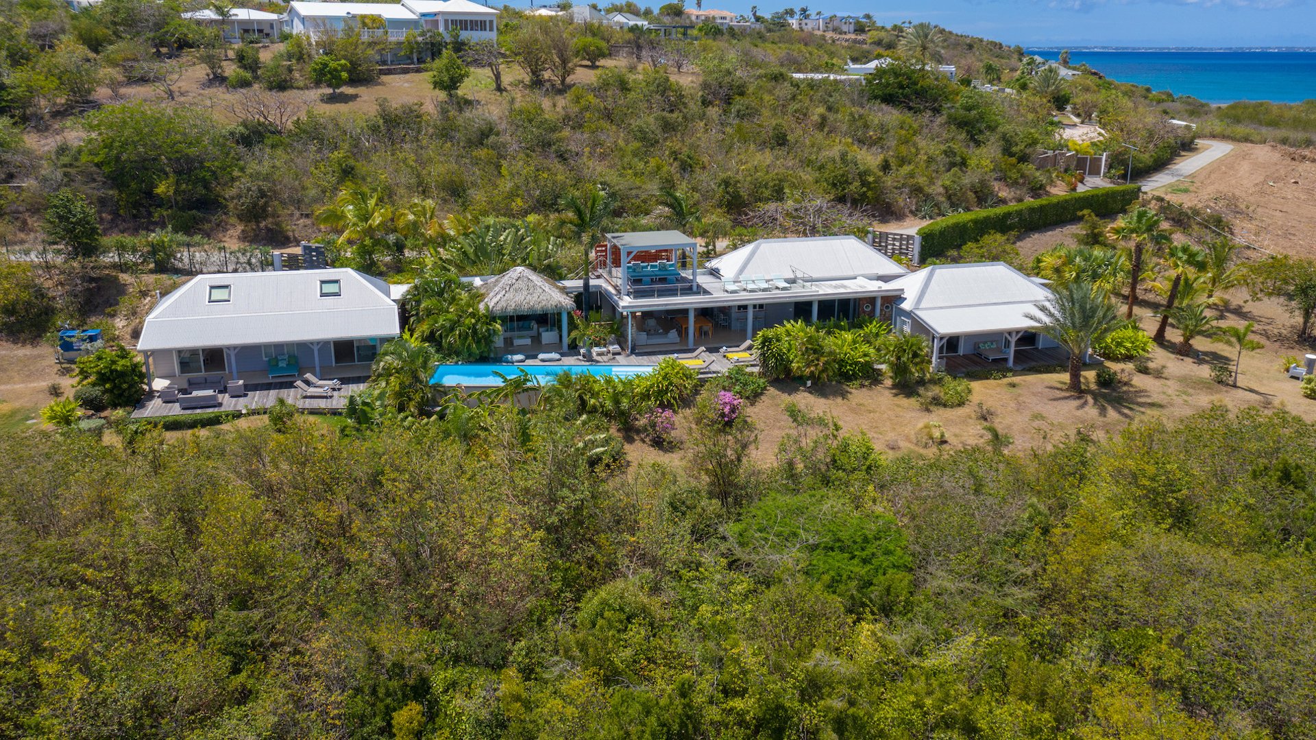 Bahia Blue, a Four-Bedroom Terres Basses Villa with Heated Infinity Pool and Rooftop Views Gallery 1