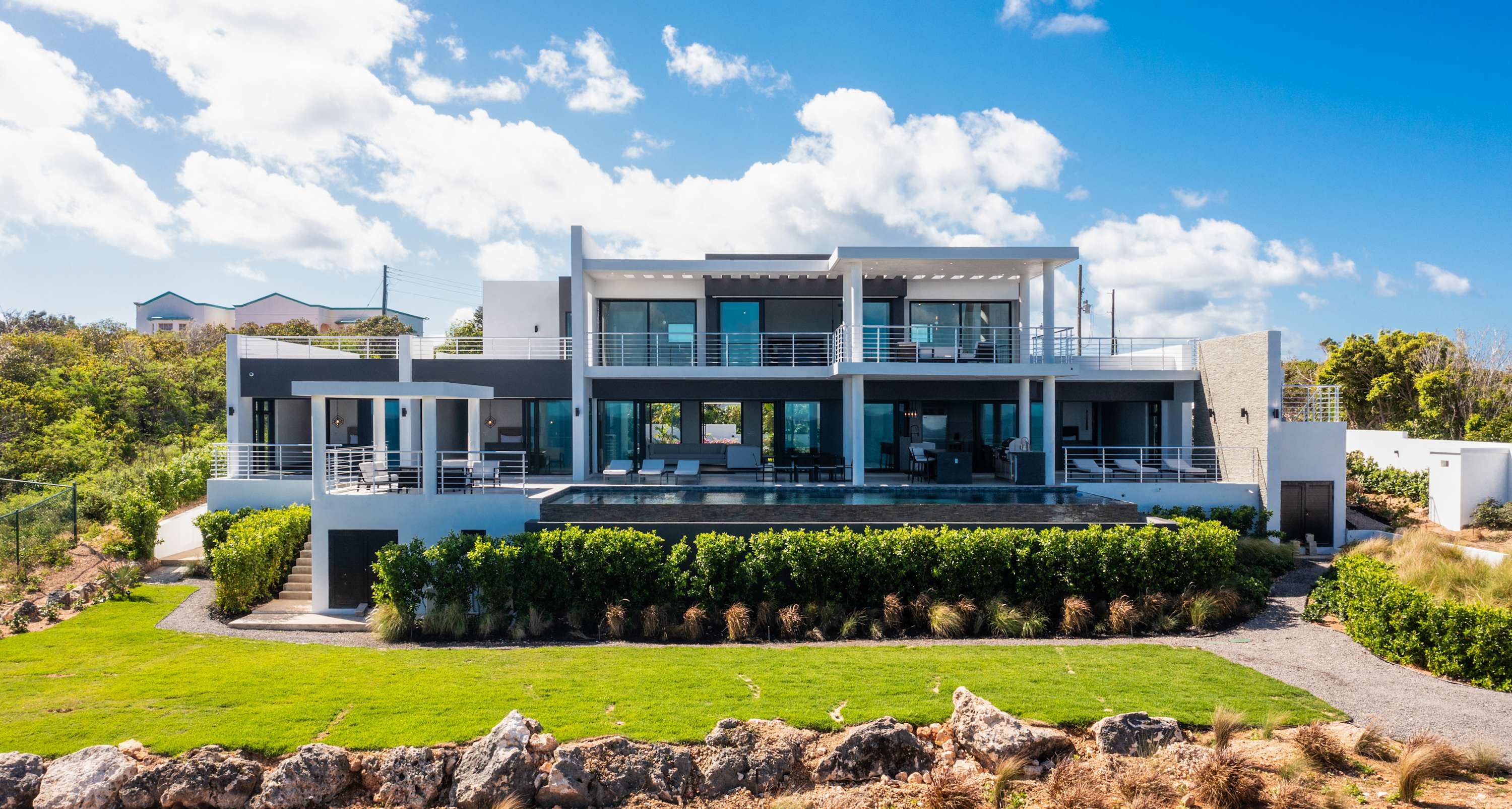 Le Rêve Bleu, a Beachfront Black Garden Villa with Pool, Jacuzzi and Four Ensuite Bedrooms Gallery 1