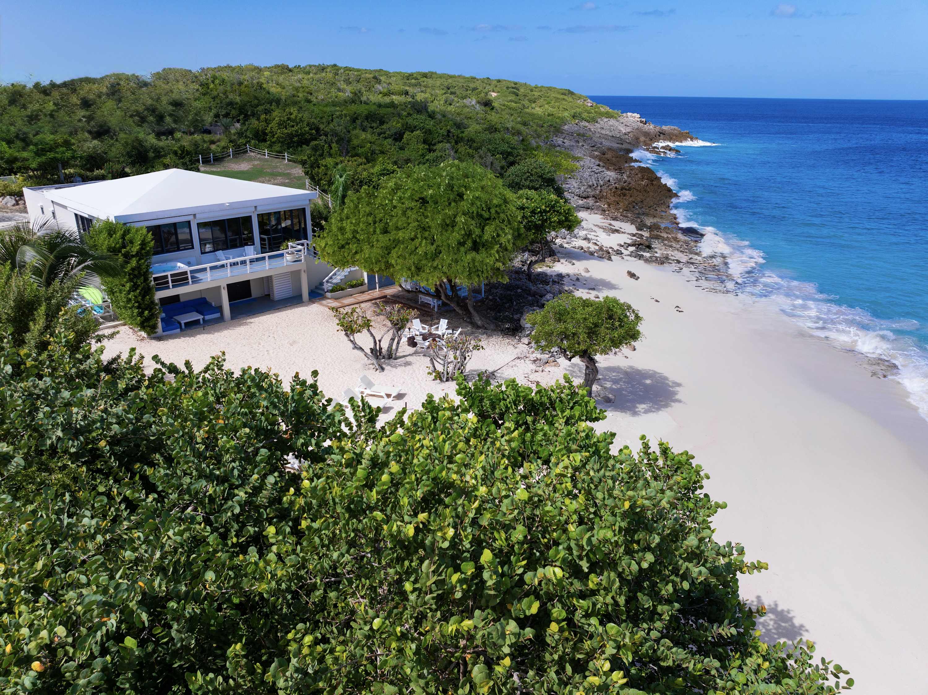 Seashell Beach House, Beachfront Limestone Bay Villa with Pool, Jacuzzi and Four King Suites Gallery 1